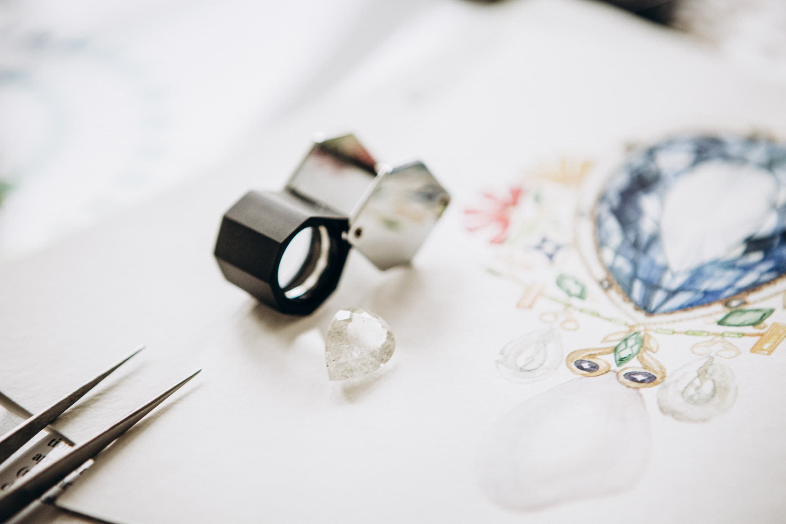 Gemological tools including loupe and tweezers